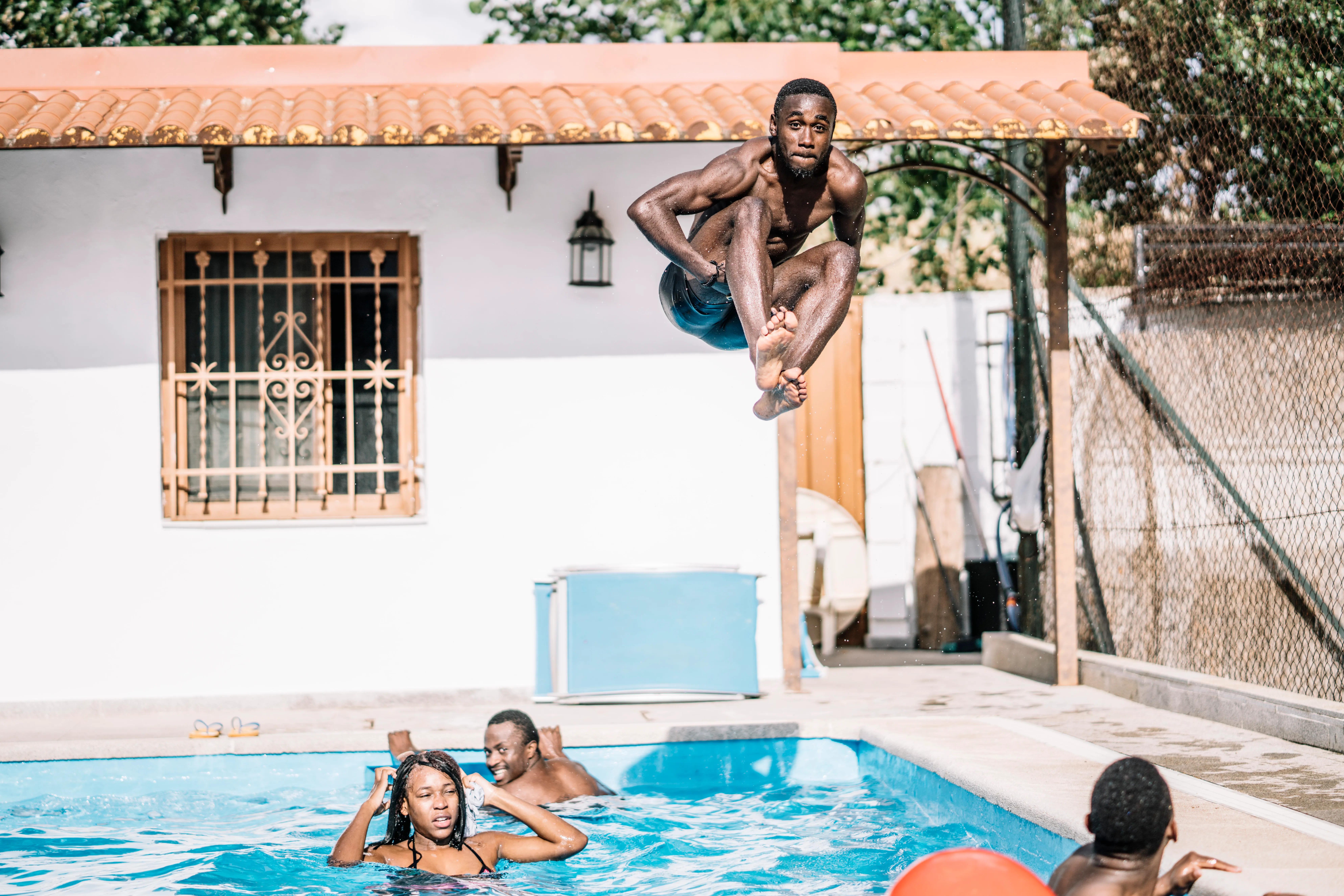 Friends playing in the pool